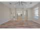Open living room with kitchen view and hardwood floors at 4522 Bay Spring Ct, Tampa, FL 33611