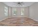 Bright living room with hardwood floors and ceiling fan at 4522 Bay Spring Ct, Tampa, FL 33611