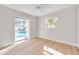 Bedroom with pool view and vinyl flooring at 11810 Marla Ln, Seminole, FL 33772