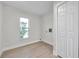 Bright laundry room with new flooring and built-in storage at 11810 Marla Ln, Seminole, FL 33772