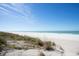 Scenic beach view with white sand and clear water at 1600 Gulf Blvd # 1112, Clearwater, FL 33767