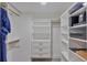 Spacious walk-in closet with ample shelving and hanging space at 1600 Gulf Blvd # 1112, Clearwater, FL 33767