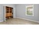 Charming bedroom with built-in shelving and window at 16313 Heathrow Dr, Tampa, FL 33647