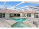 Inviting screened pool and spa with brick pavers at 16313 Heathrow Dr, Tampa, FL 33647