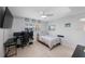 Spacious bedroom with a double bed, workspace, and ample natural light at 1753 Belleair Forest Dr # E2, Belleair, FL 33756