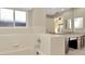 Bathroom featuring dual sinks, tiled floors and a large soaking tub at 18308 Felspar Way, Tampa, FL 33647