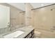 Bathroom featuring tiled floors, a granite countertop and a shower and bathtub at 18308 Felspar Way, Tampa, FL 33647