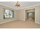 A dining room with tile floors, modern lighting and a large window at 18308 Felspar Way, Tampa, FL 33647