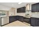 Modern kitchen with stainless steel appliances, granite counters, and a view of the pool at 18308 Felspar Way, Tampa, FL 33647
