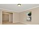 A living room with tile floors, neutral paint and a large window at 18308 Felspar Way, Tampa, FL 33647