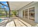 Tiled and screened-in patio, offering a seamless indoor-outdoor living experience at 18308 Felspar Way, Tampa, FL 33647
