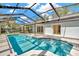 Backyard pool with a screened enclosure offering a private outdoor retreat at 18308 Felspar Way, Tampa, FL 33647