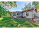 Exterior view of house with screened patio at 2601 Greendale Ct, Palm Harbor, FL 34684