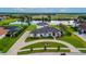 Stunning property showcasing a large home, expansive grounds, and a picturesque lake setting at 323 Hawk Talon Dr, Lithia, FL 33547