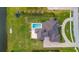 Bird's-eye view of home, pool, and large backyard at 323 Hawk Talon Dr, Lithia, FL 33547