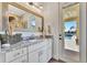 Bathroom with granite vanity and pool view at 323 Hawk Talon Dr, Lithia, FL 33547