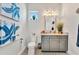 Stylish bathroom with gray vanity and mosaic tile floor at 323 Hawk Talon Dr, Lithia, FL 33547