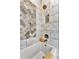 Bathroom with herringbone tile and soaking tub at 323 Hawk Talon Dr, Lithia, FL 33547