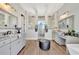 Spacious bathroom with double sinks, large walk-in shower, and elegant tile at 323 Hawk Talon Dr, Lithia, FL 33547