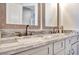 Modern bathroom with double vanity and marble countertop at 323 Hawk Talon Dr, Lithia, FL 33547