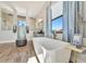 Luxurious bathroom with freestanding tub, double shower, and modern vanity at 323 Hawk Talon Dr, Lithia, FL 33547