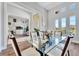 Bright dining area with glass table and views into the entryway at 323 Hawk Talon Dr, Lithia, FL 33547