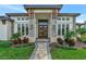 Grand entryway with stone accents and double doors at 323 Hawk Talon Dr, Lithia, FL 33547