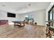 Game room with pool table, large TV, and plenty of space for entertainment at 323 Hawk Talon Dr, Lithia, FL 33547