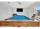 Game room features a pool table, large TV, and game boards at 323 Hawk Talon Dr, Lithia, FL 33547