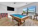 Game room featuring a pool table and a large screen TV at 323 Hawk Talon Dr, Lithia, FL 33547