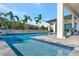 Relaxing pool with tiled steps and water features, surrounded by a patio at 323 Hawk Talon Dr, Lithia, FL 33547