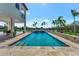 Inviting pool with spacious patio, offering picturesque water views at 323 Hawk Talon Dr, Lithia, FL 33547