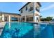 Luxury pool with a water feature, surrounded by a large patio at 323 Hawk Talon Dr, Lithia, FL 33547