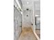 Spa-like shower with marble tile and a unique feature wall at 323 Hawk Talon Dr, Lithia, FL 33547