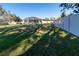 Expansive grassy backyard with a view of the home and pool at 4121 70Th Street E Cir, Palmetto, FL 34221