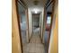 Bright hallway featuring tiled floors and multiple doorways at 432 2Nd Ne Ave, Largo, FL 33770