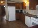 Clean kitchen with ample counter space and white appliances at 4635 Orange Blossom Dr, Zephyrhills, FL 33542