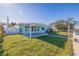 House exterior showcasing a light blue color with a covered patio at 480 115Th Ave, Treasure Island, FL 33706