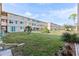Building exterior showcasing landscaping and lawn at 4915 Bay Ne St # 130, St Petersburg, FL 33703