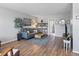 Bright living room featuring hardwood floors, comfy furniture, and a TV at 4915 Bay Ne St # 130, St Petersburg, FL 33703