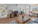 Living room with hardwood floors, a large TV, and comfortable seating at 4915 Bay Ne St # 130, St Petersburg, FL 33703