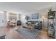 Living room with hardwood floors, comfy seating, and large windows at 4915 Bay Ne St # 130, St Petersburg, FL 33703