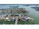 Aerial view of a waterfront home situated on a canal, offering convenient boat access and beautiful water views at 498 Crystal Dr, Madeira Beach, FL 33708