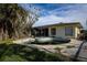 Backyard view featuring an in-ground pool at 498 Crystal Dr, Madeira Beach, FL 33708