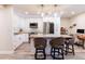 Modern kitchen with white cabinets, granite island and stainless steel appliances at 6370 1St N St # 106, St Petersburg, FL 33702