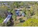 Aerial view of a single story home with large backyard and tropical landscaping at 6434 Oelsner St, New Port Richey, FL 34652