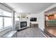 Open living room with a fireplace and view into the kitchen at 7100 14Th N St, St Petersburg, FL 33702