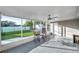 Screened porch with tile floor, ceiling fan, and view of backyard at 7100 14Th N St, St Petersburg, FL 33702