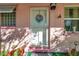 Pink house with a white front door, wreath, and no soliciting sign at 8161 54Th N St, Pinellas Park, FL 33781