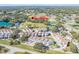 Aerial view showcasing townhouse community near park and tennis courts at 9515 Citrus Glen Pl, Tampa, FL 33618